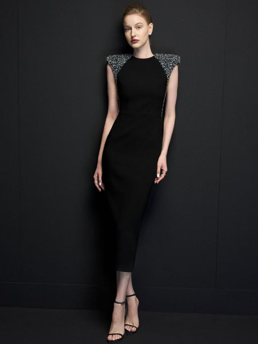 Black fashionable evening dress with shoulder pads