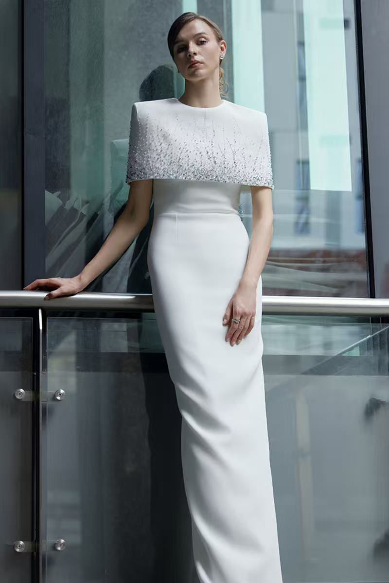 Luxurious,heavy beaded white long dress with a magnificent shawl cape